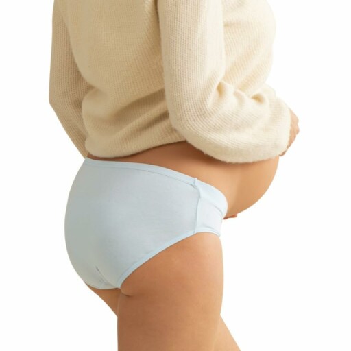 A woman wearing the maternity underwear, showing the comfort and support it provides.