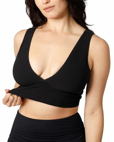 Person wearing a black crop top.