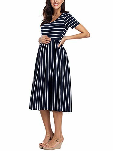 Woman wearing a navy blue and white striped maternity dress.