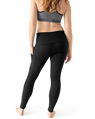 Woman wearing black leggings and sports bra, back view.