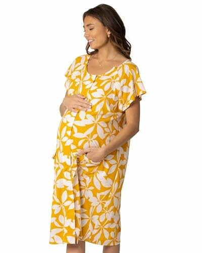 Pregnant woman in yellow floral maternity dress