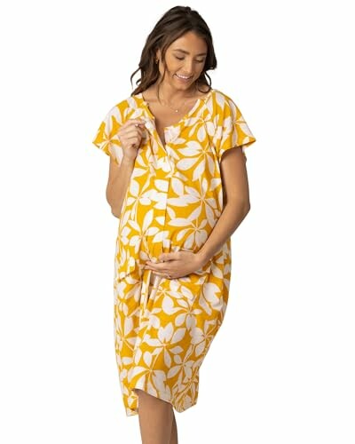 Woman in yellow floral maternity dress